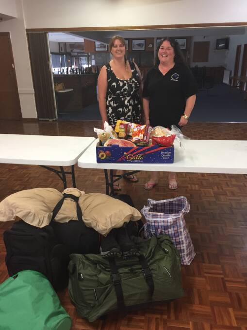 Community aid: Brooke Wright and Julie Allan of the Ballarat East Bowling Club with some of the goods donated for the unknown homeless man. Photo: Caleb Cluff