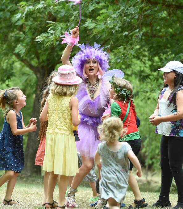 SWEET LAVENDER: The Lavender Fairy working her flowery magic on children at Lavandula, as children help to repair her malfunctioning wand. Picture: Kate Healy