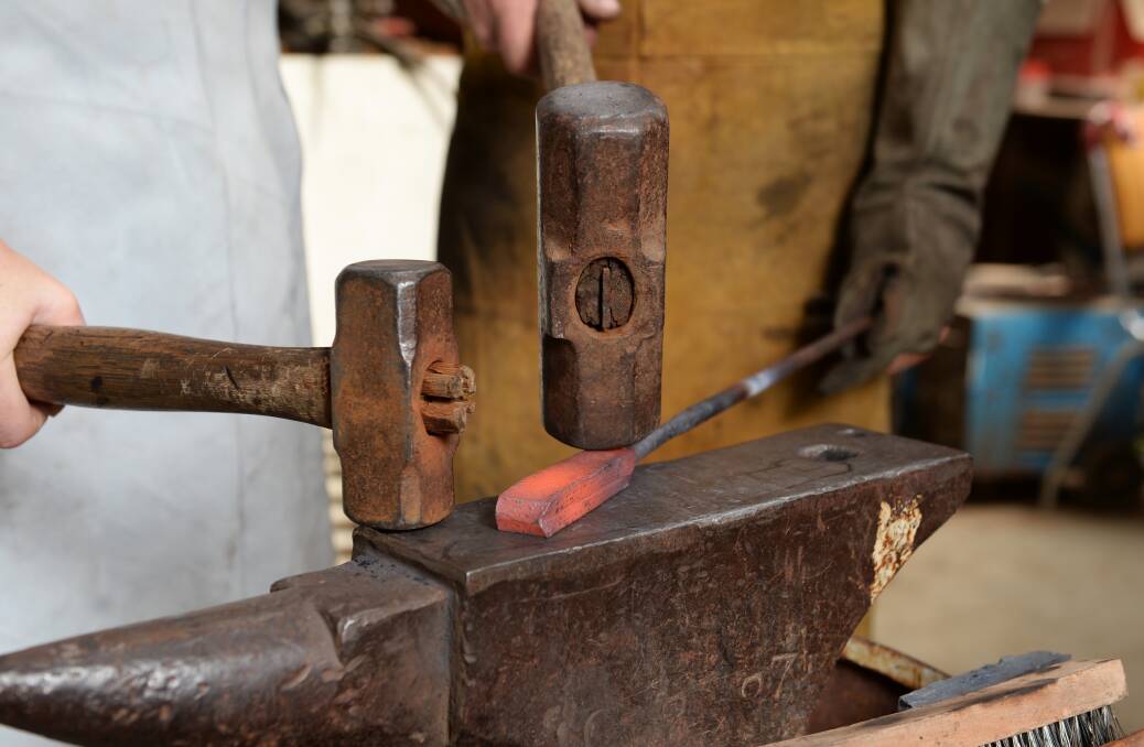 Forging the billet into a single piece of metal. Photo: Kate Healy