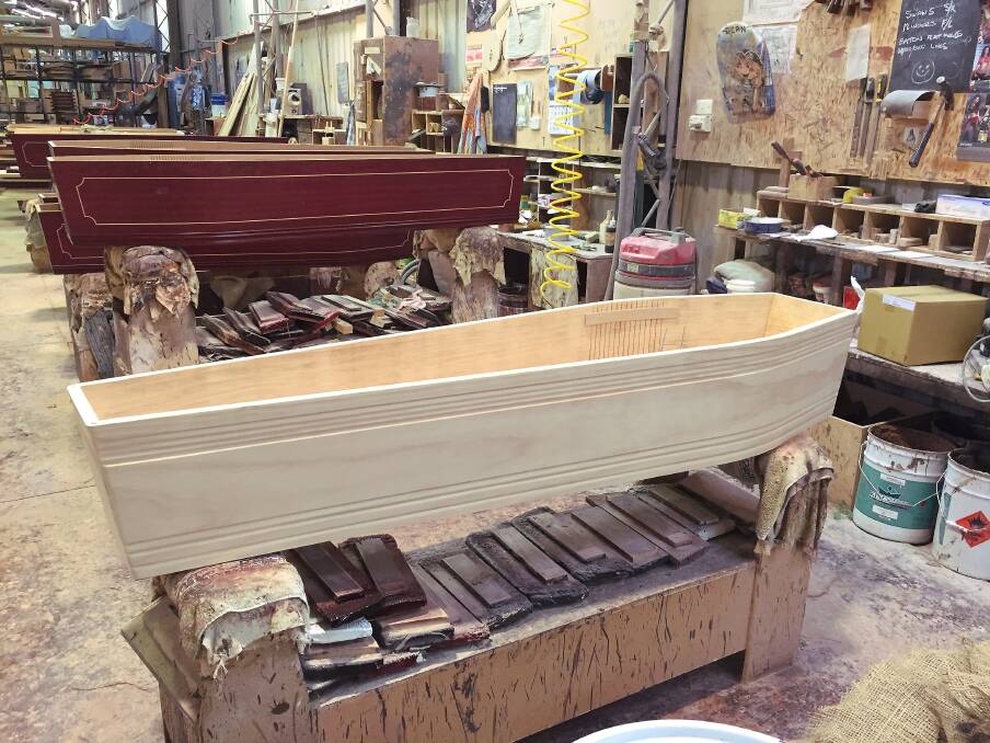 A solid pine coffin waiting to be stained. Photo: Caleb Cluff.