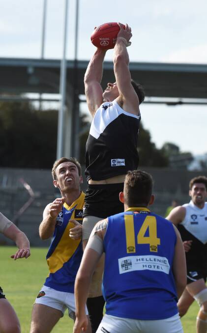 PLUCK: Roosters' Lane Buckwell takes one of the marks of the day last week against Williamstown. Picture: Lachlan Bence