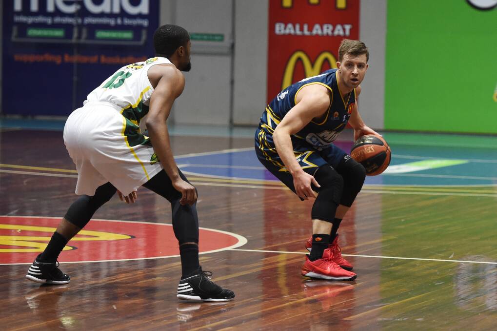 PLAYMAKER: Ballarat Miners' Ash Constable glides down the court against Dandenong Rangers last week. He will be a key component to posting a victory over Bendigo on Saturday night. Picture: Kate Healy.