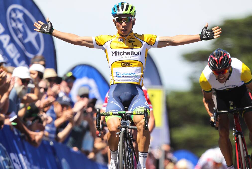 RETURNING: Caleb Ewan celebrates on the line in the 2015 men's elite 
criterium in Mitchelton Bay Cycling Classic. Picture: Getty Images