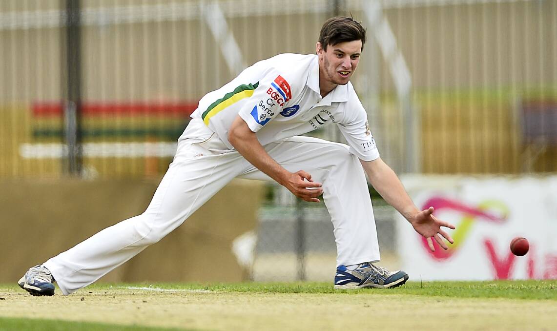 RETURN FIELD: Ballarat-Redan's Jayden Hayes fields off his own bowling during his side's Ballarat Cricket Association clash with Golden Point last season.