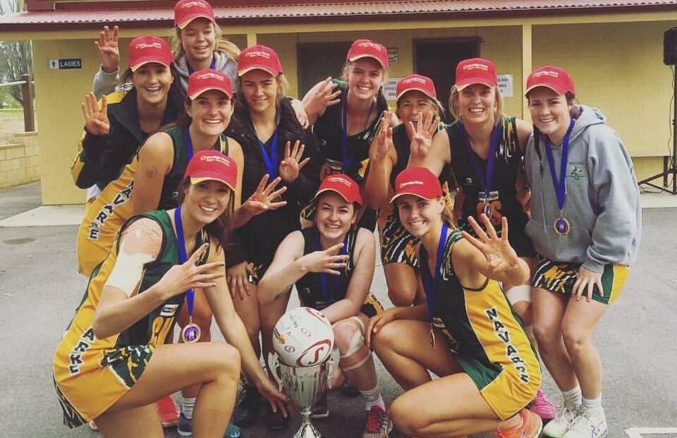 FOUR-PEAT: Navarre netballers celebrate their grand final victory on Sunday. The group has enjoyed a wealth of success - this its fourth consecutive premiership.