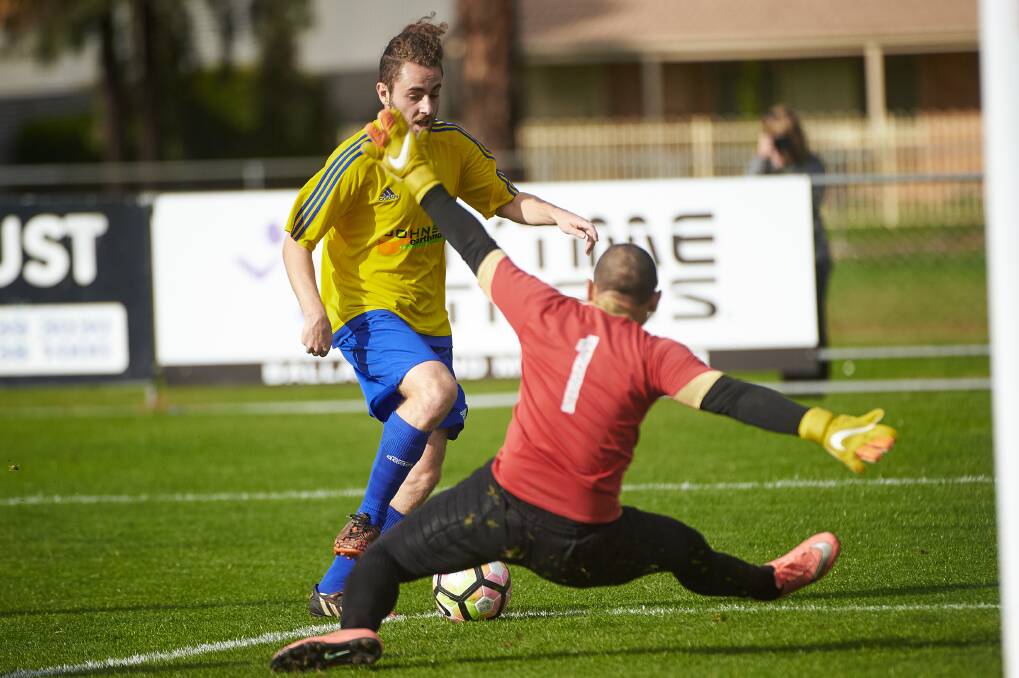 ONE-OUT: Sebastopol Vikings' Pietro Angeli looks to get around the goalkeeper in last week's clash with Newmarket Phoenix. Phoenix forfeited after half-time. Picture: Luka Kauzlaric