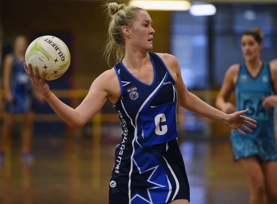 FOOTBALL FAMILY: Sovereigns' Laura McDonald plying her trade on the netball court against Boroondara Express earlier this season. Picture: Kate Healy