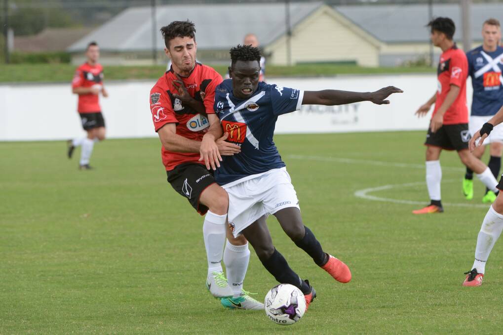 CONTEST: Nelson Salvatore tangles with his Whittlesea opponent last week as Ballarat City registered a 1-0 victory. Picture: Kate Healy