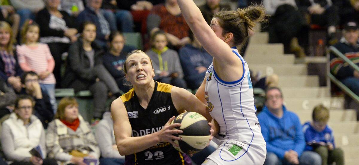 DRIVE: Melbourne Boomers' Maddie Garrick drives hard to the basket in the side's six-point loss to Bendigo.