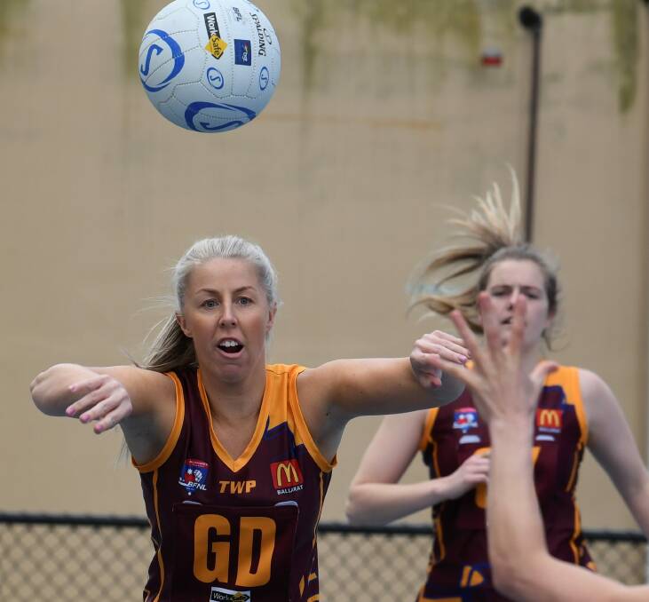 TOUGH HIT-OUT: Redan's Emma Inverarity sends the ball down the court in Saturday's 14-goal loss to Sunbury in the A grade preliminary final.