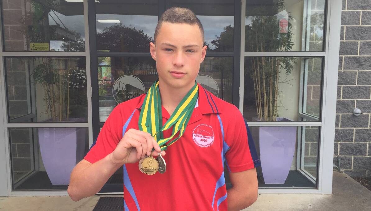 GOLD, SILVER AND BRONZE: Talented sportsman Jake Ashmore, 12, won three medals at the track and field national titles in Sydney.