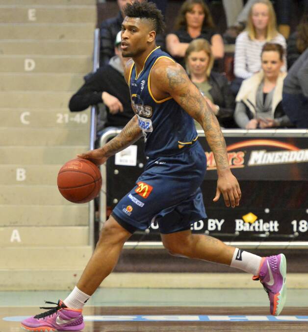 TRANSITION: Ballarat Miners' Earnest Ross brings the ball down the court against Geelong SuperCats this season. Picture: Dylan Burns