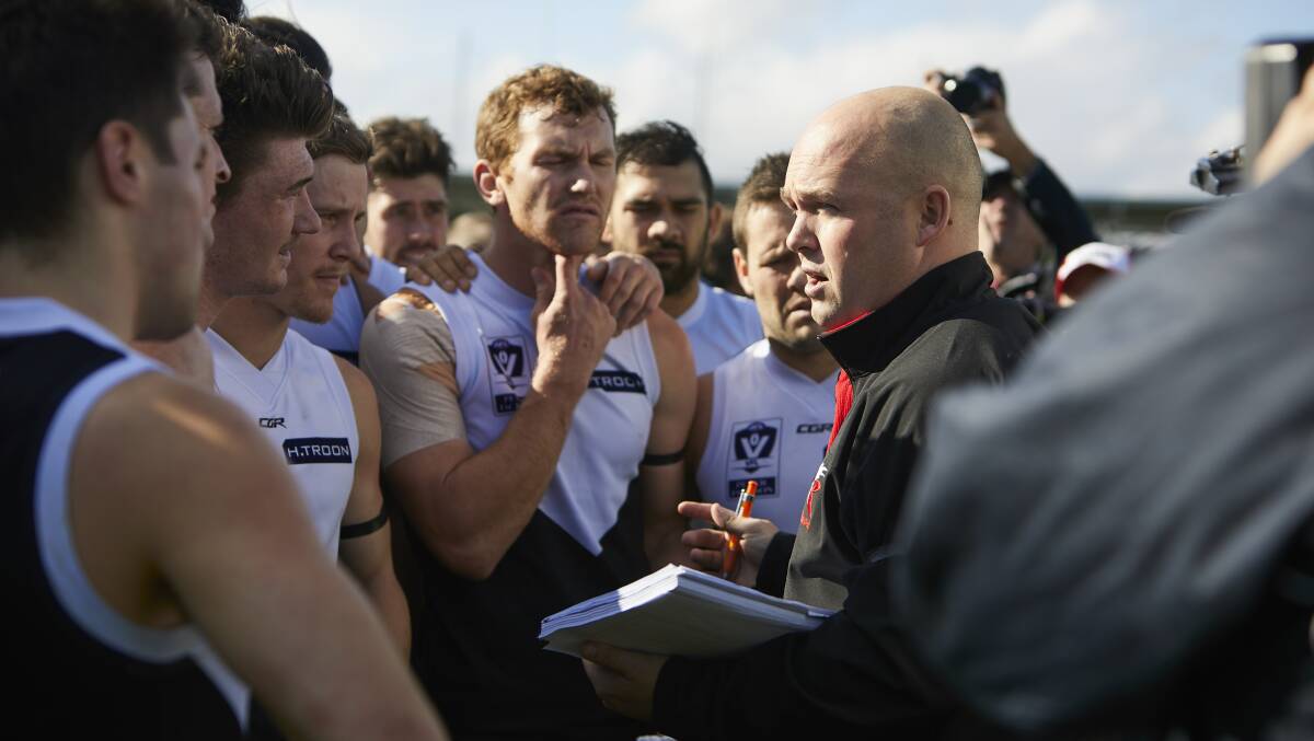 ADDRESS: Roosters coach Marc Greig talks to his playing group in last week's loss to Werribee.