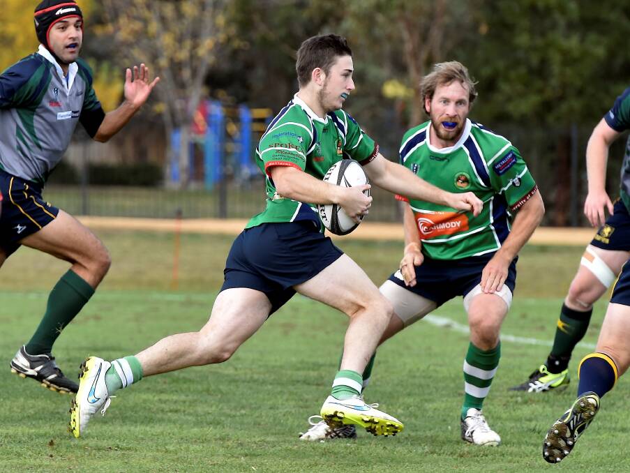 PACE: Ballarat Rugby's Mitch Cattell breaks away at speed from his Melbourne Chargers' opponents at Doug Dean Reserve. Picture: Jeremy Bannister