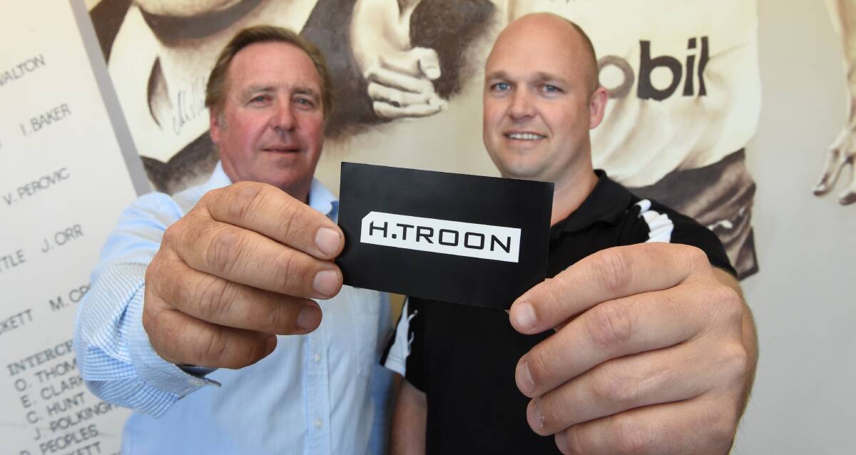 UNITED: H. Troon's Steve Troon and North Ballarat Roosters coach Marc Greig show off the club's new naming rights sponsor. Picture: Lachlan Bence
