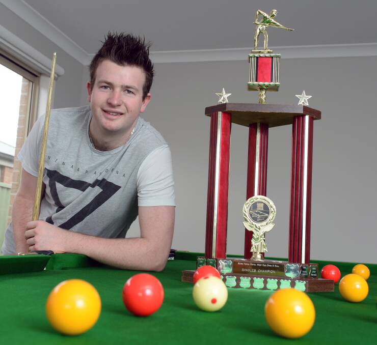 AT HOME ON THE BIG STAGE: Nick Young shows off his silverware on his newly purchased pool table. Picture: Kate Healy.
