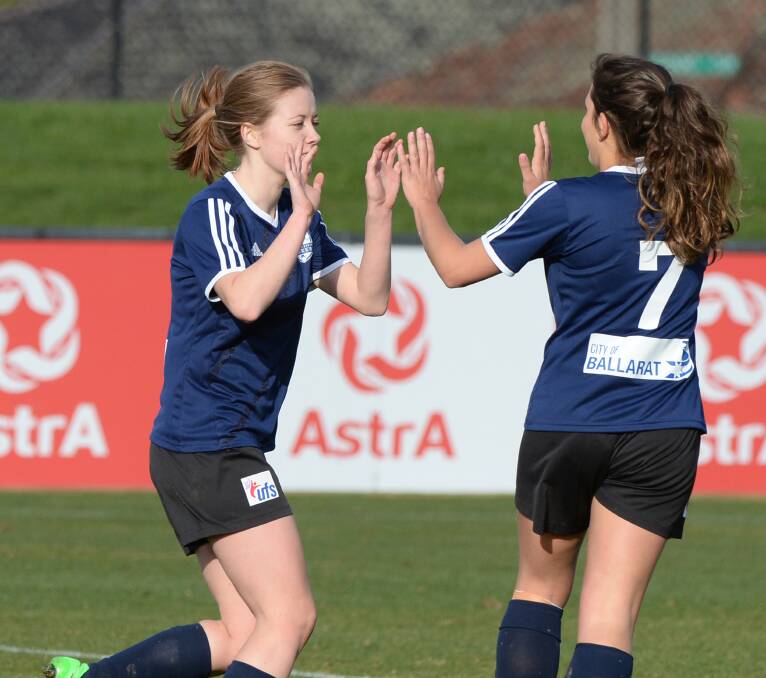 HIGH FIVES: Ballarat teammates Alison Pym and Lulu Al-Huneidi celebrate on Sunday. Picture: Kate Healy.