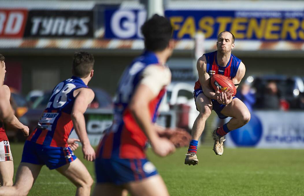 LEAP: Hepburn player Daniel Rees makes sure of this chest mark on Sunday. Rees was named Hepburn's best player.