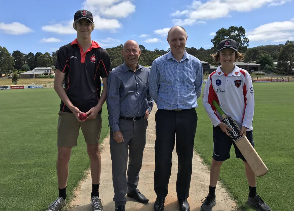 GOOD NEWS: Buninyong junior cricketers Nathan Sutcliffe (left) and Bailey Ryan (right) with Buninyong MP Geoff Howard and Buninyong Cricket Club president Jason Giri.