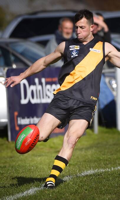 LAUNCH: Billy Driscoll sends Springbank forward during the Tigers' impressive victory over Buninyong on Saturday. Picture: Luka Kauzlaric.