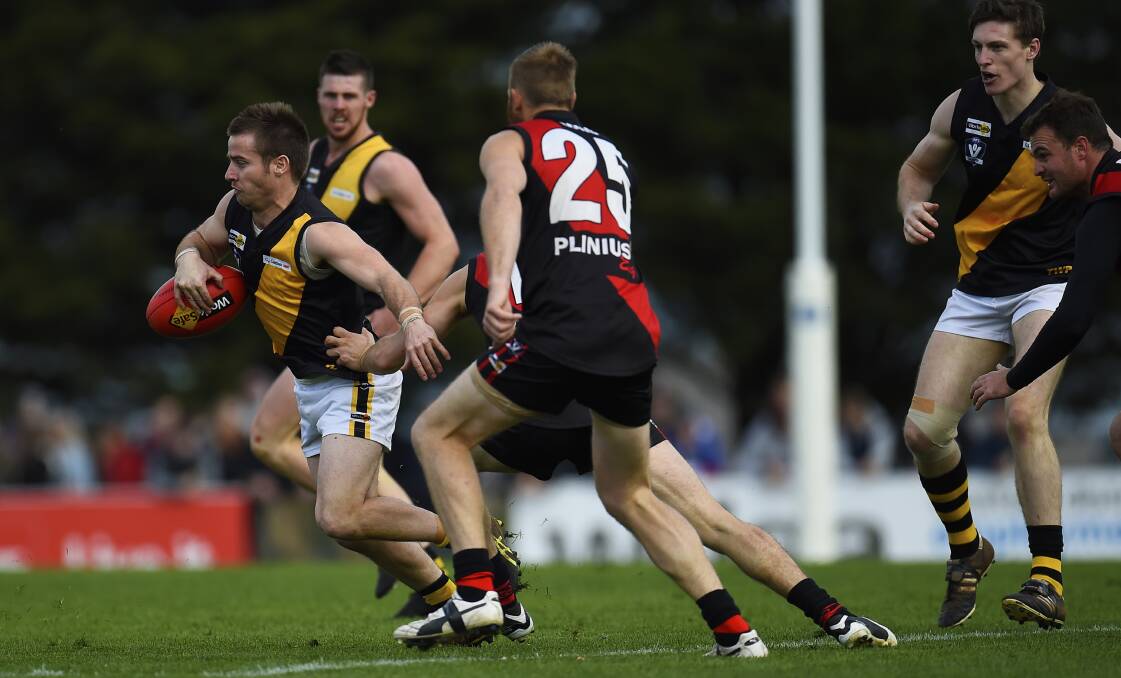 TAKING IT ON: Tyler George tries to break through the Buninyong defences on Saturday. Picture: Luka Kauzlaric.