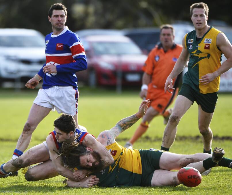 CRUNCH: Daylesford's Joel Cowan lays a tough tackle on Gordon's Josh Lee during Saturday's first semi-final clash at Learmonth.