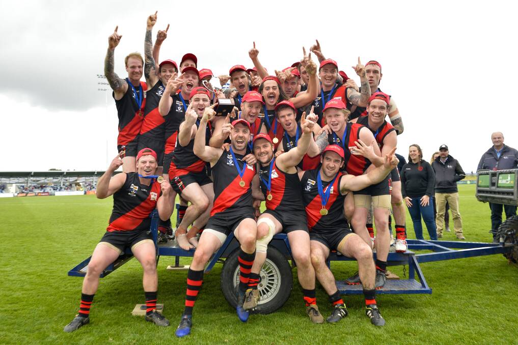 RESERVES PREMIERS: Buninyong players celebrate the grand final success against Beaufort. The Bombers won the game by eight points, 7.8 (50) to 5.12 (42).