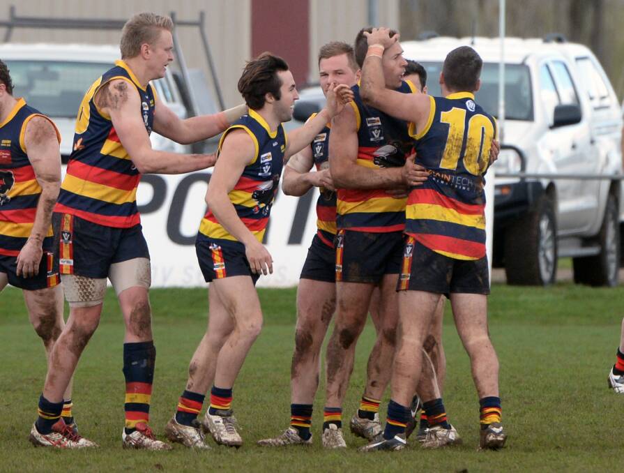 TEAMWORK: Beaufort players celebrate a goal during the hard-fought victory against Buninyong on Saturday. The Crows have now booked their place in a preliminary final.