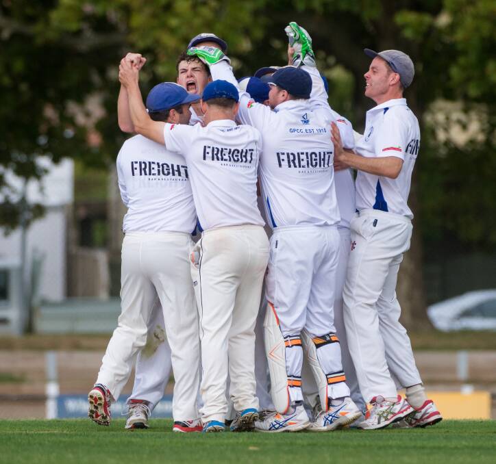 YOU BEAUTY!: Golden Point all-rounder Simon Ogilvie is mobbed by teammates after a wicket on Saturday at the Eastern Oval.