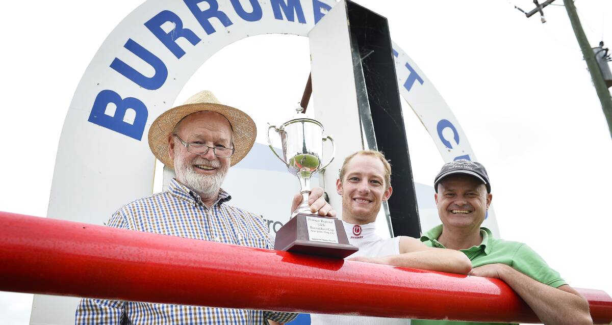 WINNERS: Jockey Jack Hill (centre) with Unfurl's part owners Melville and Scott Charles after the Burrumbeet Cup triumph on Sunday. Picture: Dylan Burns.