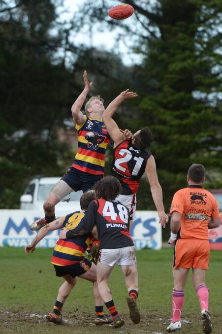 BIG MEN FLY: Beaufort's Josh McDermott and Buninyong's Anthony Ebery battle in the ruck on Saturday at Bungaree. Pictures: Kate Healy.