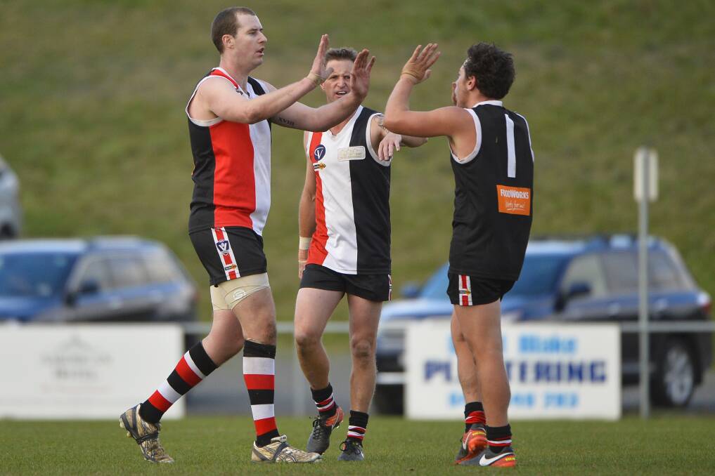BIG DAY: Clinton Robinson and Aaron Sedgwick celebrate a goal during Creswick's win over Daylesford. Picture: Dylan Burns.