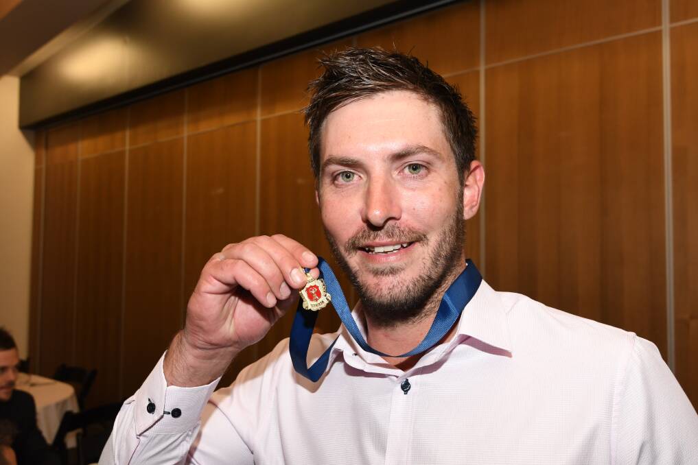 DESERVING WINNER: VRI Delacombe captain-coach Jarrod Burns shows off his Bernie Davey Medal on Wednesday night. Picture: Lachlan Bence.