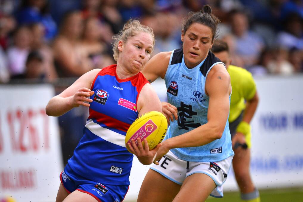 EVASIVE ACTION: Western Bulldogs player Aisling Utri tries to stay clear of Carlton opponent Katherine Gillespie-Jones during Saturday's AFLW clash.