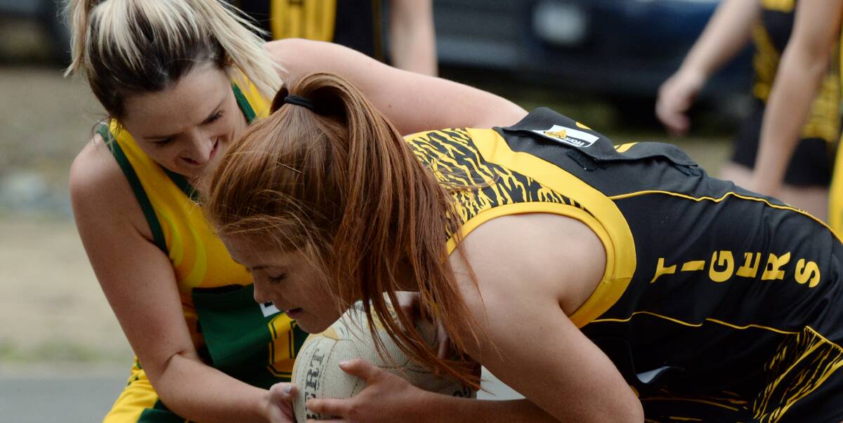 IT'S MINE: Jornita Cram (Gordon) and Kelly Conroy (Springbank) fight for the ball during the A-grade clash won by the Tigers on Saturday. Picture: Kate Healy.