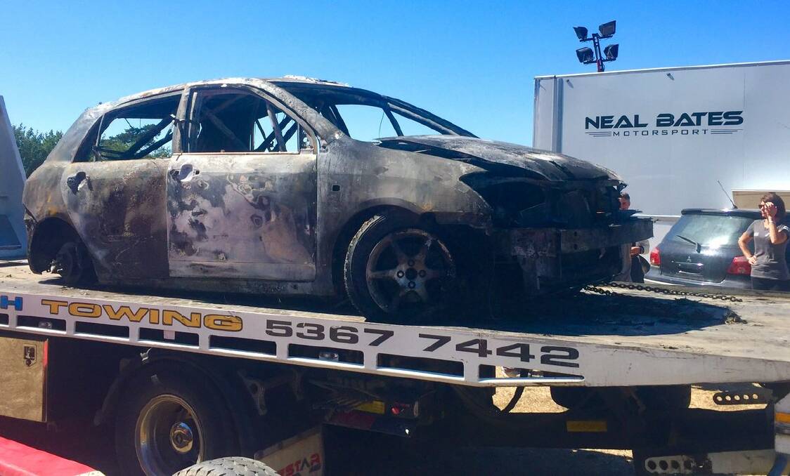 BURNT: Lewis Bates' car is towed away after the fire. Picture: Chad Neylon - Twitter.