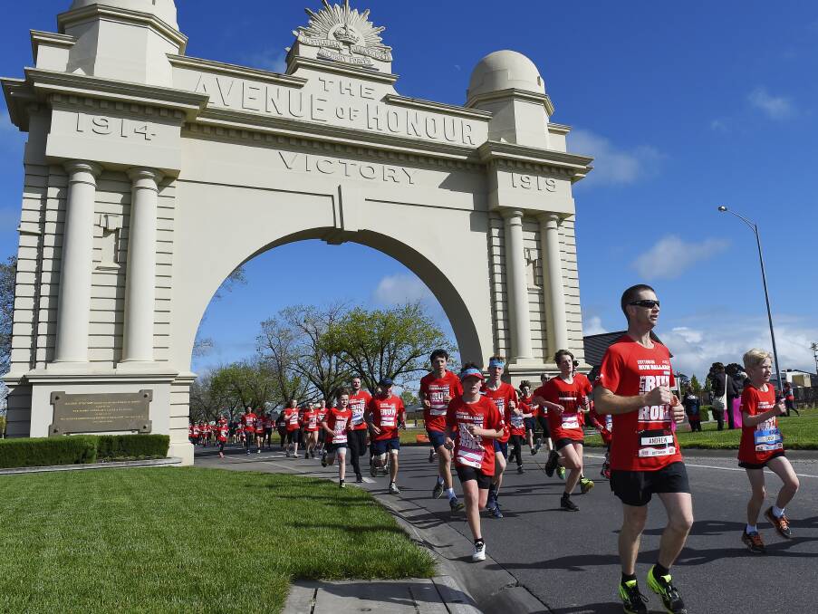 PICTURESQUE: Runners pass through the Arch of Victory in Sturt Street during Sunday morning's popular Run Ballarat event.