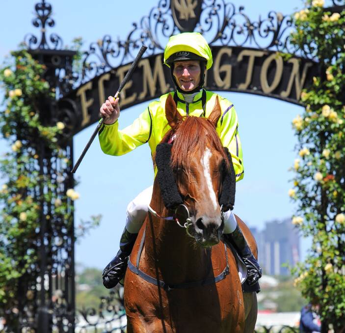 MEMORIES: Jockey Brad Rawiller returns to scale on Taiyoo following a win at Flemington during 2015. Rawiller rode the horse to victory on six occasions. Picture: Getty Images.