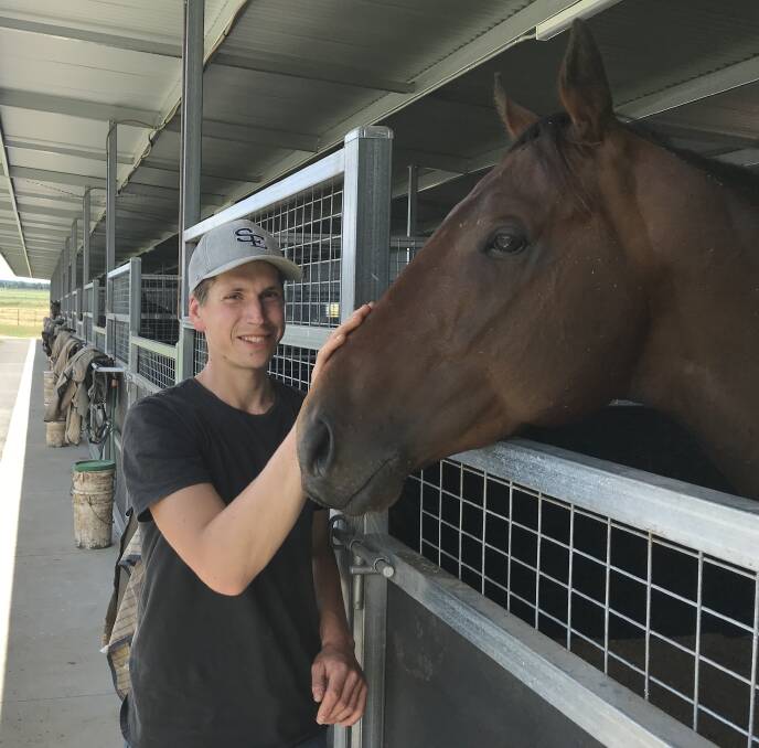 NEW HOME: Mitch Freedman is pictured with one of his emerging stars Bravo Tango at his new property. Freedman has already had three winners since moving to the new complex.