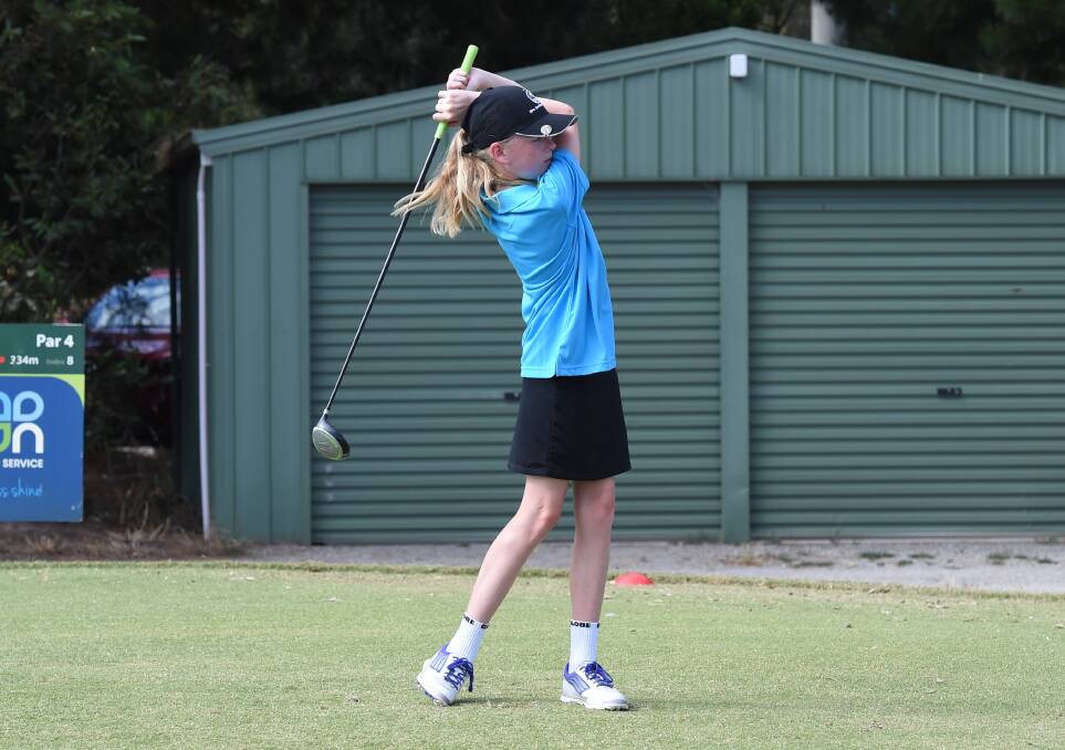NICE STYLE: Millie Cassidy watches her ball fly down the fairway during the Ballarat District Golf Incorporated Junior Classic on Monday.