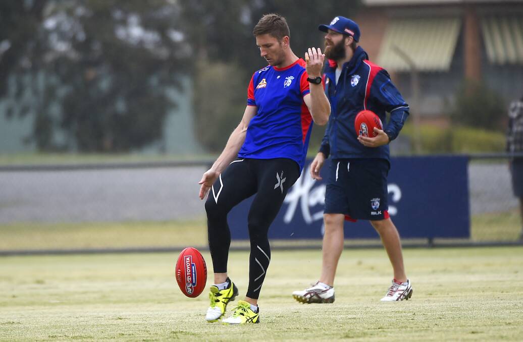 PASS: Western Bulldogs veteran Matthew Boyd lines up a teammate during the session at Wendouree Reserve on Wednesday. Pictures: Luka Kauzlaric.