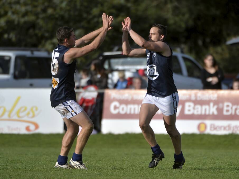 HIGH FIVES: Sam Turner and Jack Duke celebrate a goal for the Central Highlands Football League on Saturday afternoon.