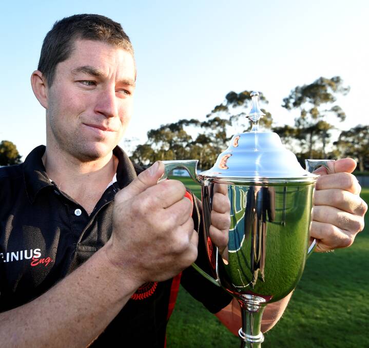 SO CLOSE: Buninyong co-captain Sam Turner gets a feel for the Central Highlands Football League senior premiership cup he so dearly wants to win. Picture: Lachlan Bence.
