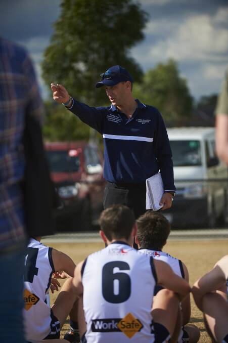 LEADER: Central Highlands joint-coach Johno Leoncini speaks to his players during the under-19 clash against the Southern league. Pictures: Luka Kauzlaric.