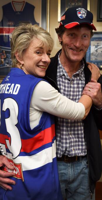 CAN'T WAIT: Husband and wife team Bernie O'Brien and Paul Roughead are ready to watch their son Jordan play in the AFL grand final. Picture: Lachlan Bence.
