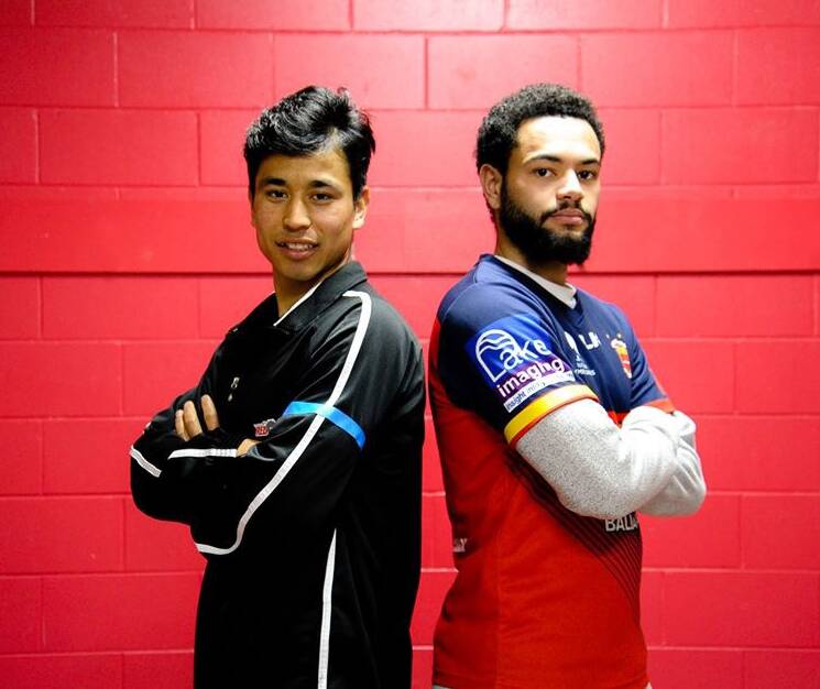 UNITED: Ballarat Red Devils players Ibrahim Ghulami and David King show off the arm bands that they will wear on Saturday. Picture: M&A Sports Photography.