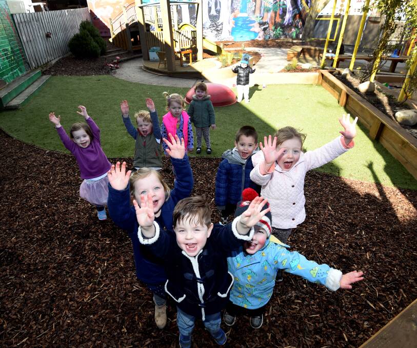 HOORAY!: Youngsters at Occasional Child Care Centre jump for joy following the completion of a new playground at the Ballarat premises. Picture: Lachlan Bence.