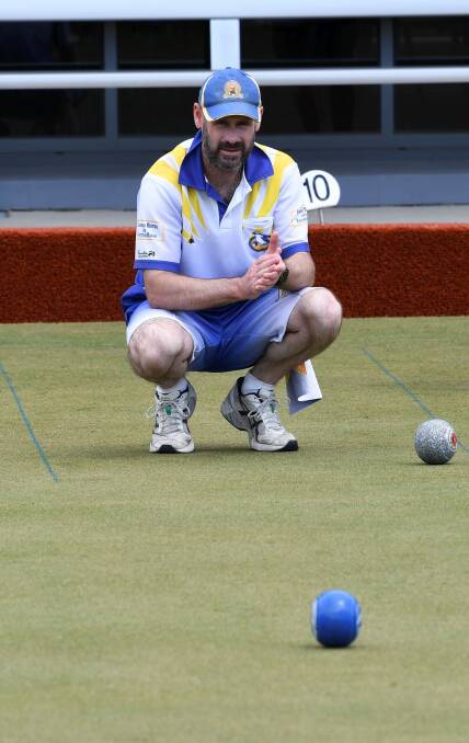 LINING IT UP: Sebastopol skipper Rob Baker takes a good look at the state of play during Saturday's Geelong-Ballarat Premier Bowls clash with BMS. Pictures: Lachlan Bence.