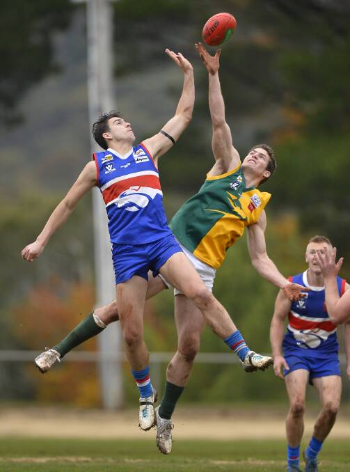 RUCK BATTLE: Max Risstrom (Daylesford) and Luke Gunnell (Gordon) fly for the ball during a match last season. A new rule in 2017 means only the two designated ruckmen can contest stoppages.