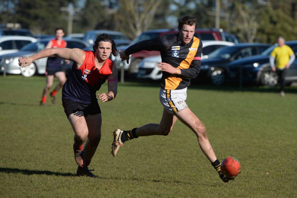 RIVALS: Grant Trevenen (Bungaree) and Matthew Tyler (Springbank chase the ball on Saturday. Picture: Kate Healy.